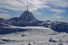 The summit cairn on Mt Loch with squid pole