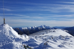 The summit cairn with Mt Feathertop in the background