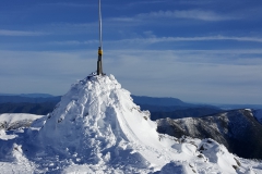 The summit cairn, skis and squidpole