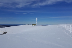 The summit of Mt Hotham looking back to the communications tower