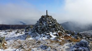 The summit cairn with distinctly less snow than last year!