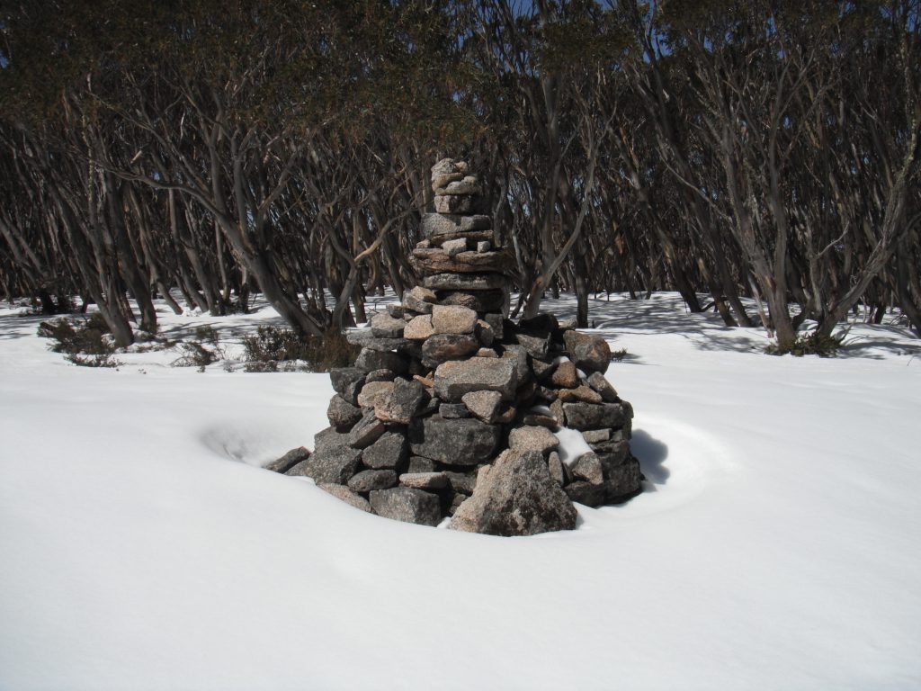 The summit cairn - sunshine and pristine snow